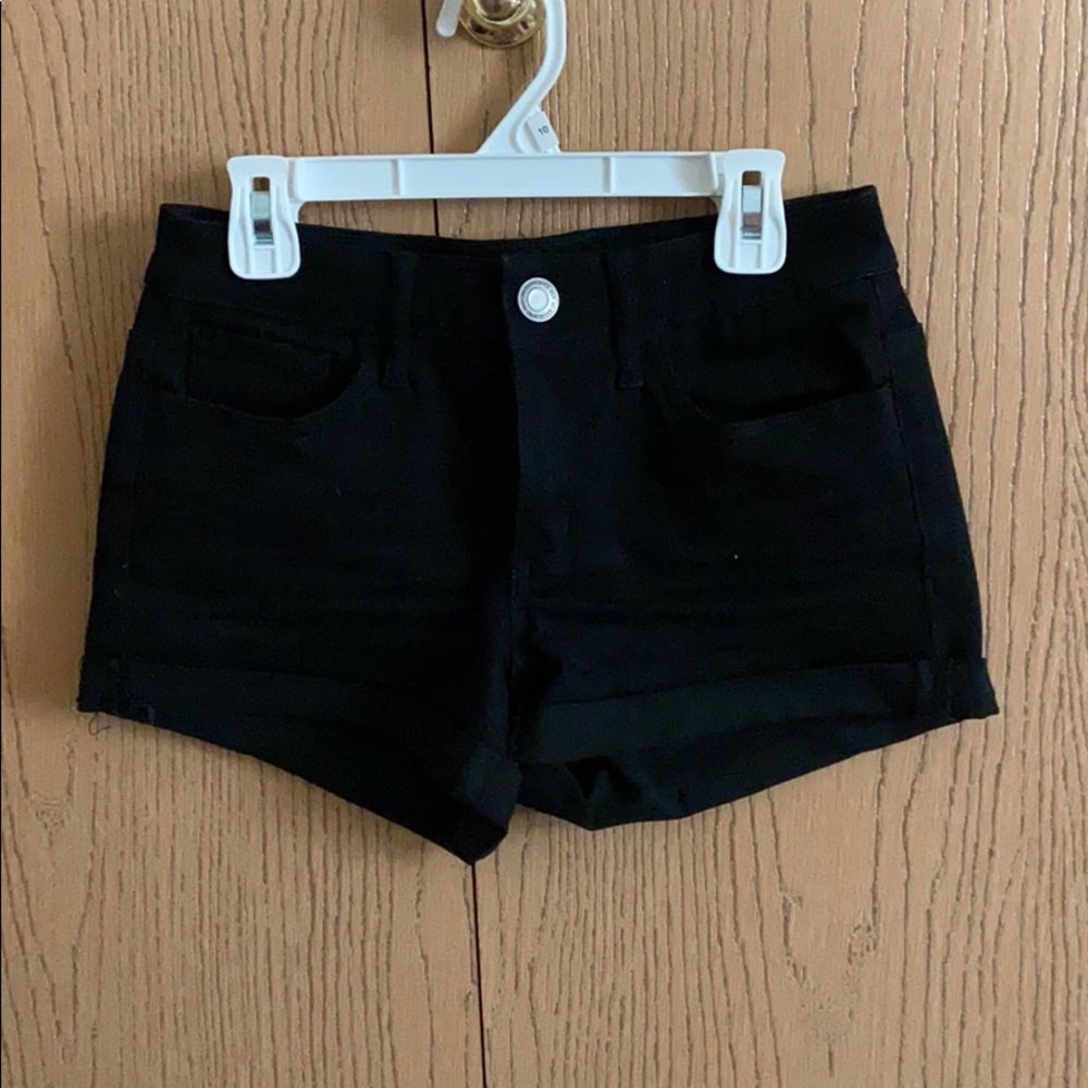 Black denim shorts.